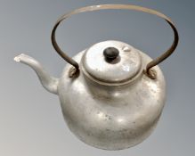 A mid 20th century aluminium cast iron handle oversized kettle