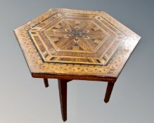 An Edwardian hexagonal occasional table with marquetry inlaid top