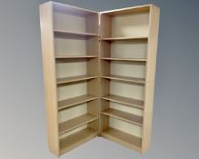 Two sets of open bookshelves in pine finish