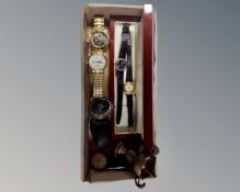 A box of a silver trophy and six assorted watches including Rotary, Cross Hatch,
