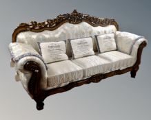 A contemporary Rococo style high backed settee in classical fabric,