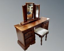 A Willis and Gambier seven drawer twin pedestal dressing table with matching triple mirror and