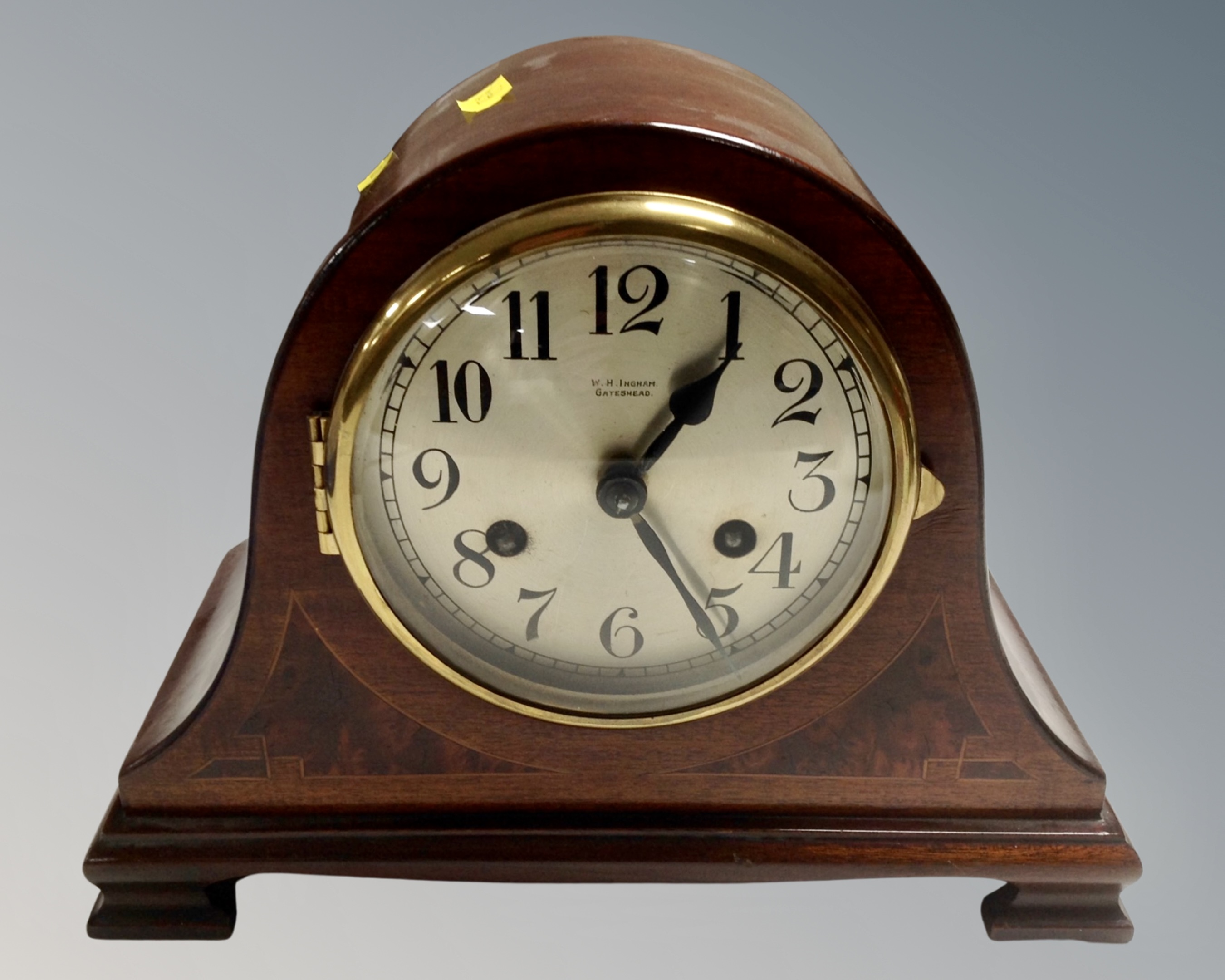 An Edwardian inlaid mantel clock retailed by W & H Ingham of Gateshead