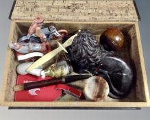 A table box in the form of a book containing vintage pipe with ceramic bowl, Weetabix letter opener,