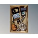 A box of silver plated wine tasting cup, vintage pipe, cloisonne match holder,