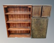 A set of stained pine open bookshelves,
