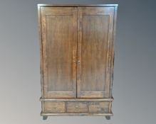 A Willis and Gambier double door wardrobe fitted with three drawers,
