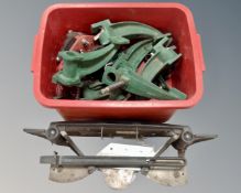 A box containing industrial metal cleats together with metal cutter