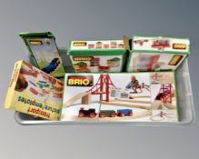 A box of four boxed Brio train sets and accessories,