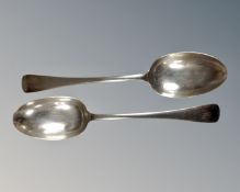 A pair of silver serving spoons,
