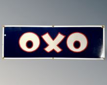 An Oxo enamelled sign on blue ground, with white border,