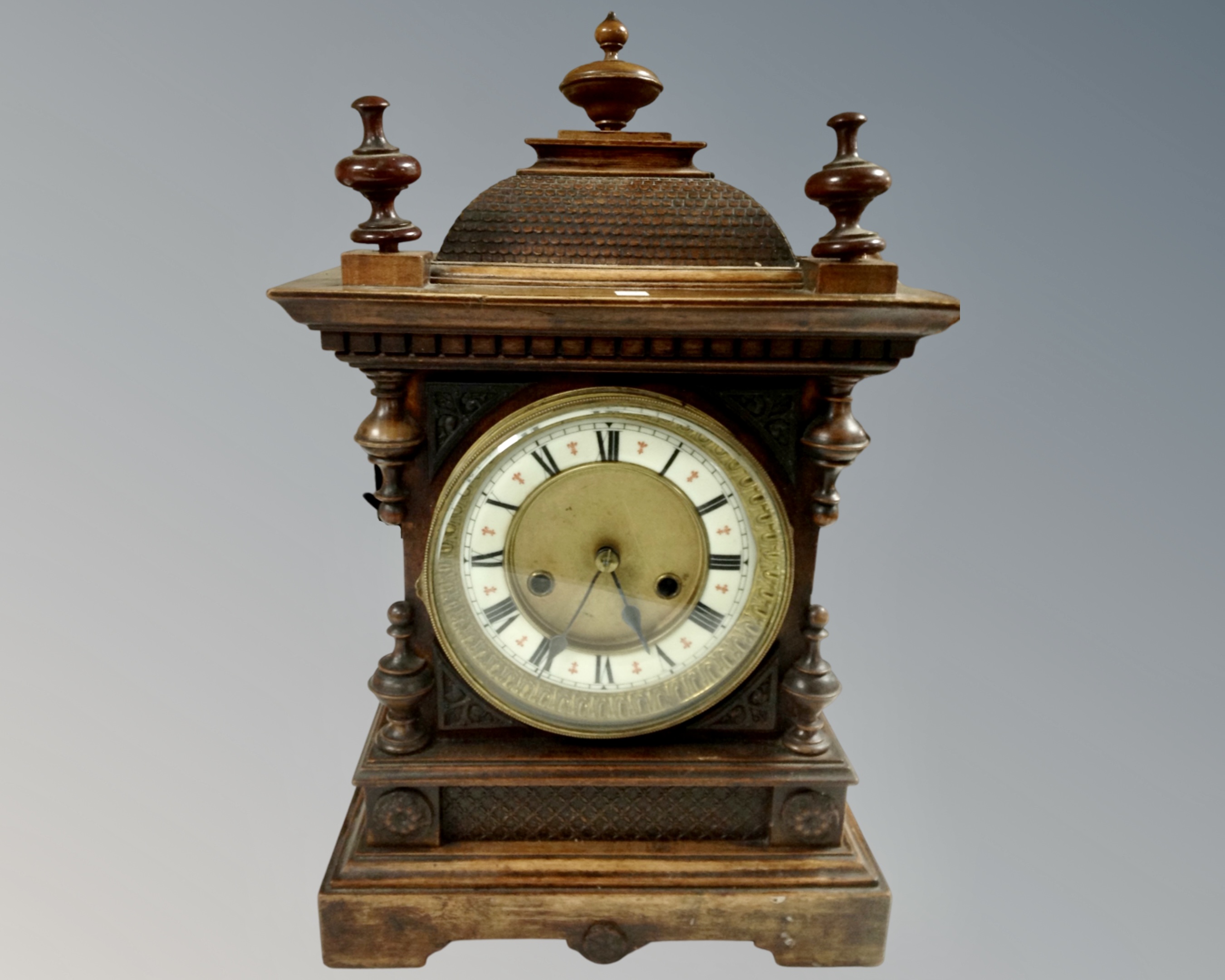 A Victorian mahogany and beech mantel clock with brass and silvered dial