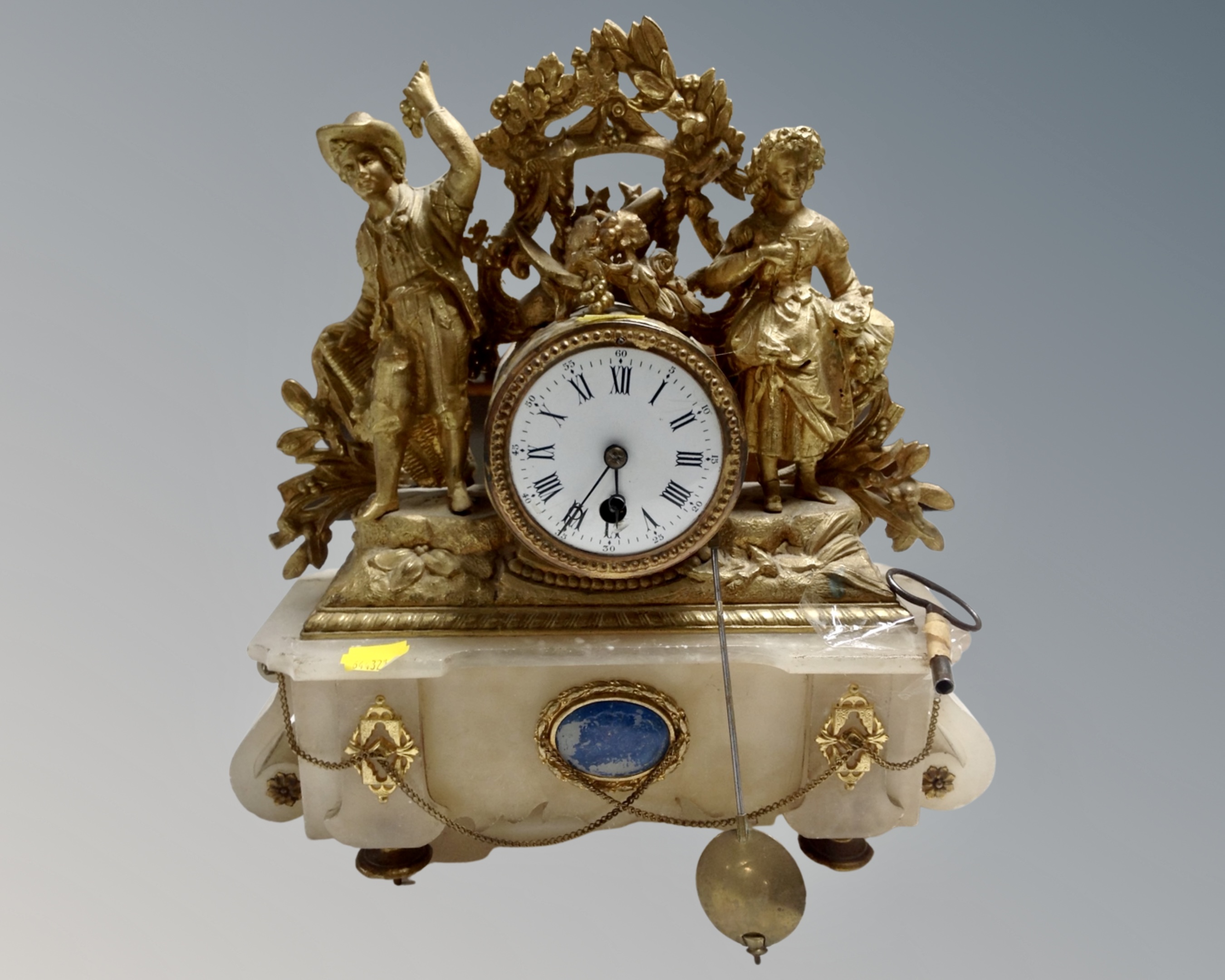 A French gilt and alabaster mantel clock