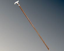 A silver handled walking stick,