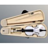 A violin and bow in carry case,