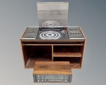 A Bang & Olufsen Beocenter 2000, together with a Beomaster 900 and a Rosewood veneered music stand.