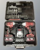 A Milwaukee M18 Red Lithium-ion drill and impact drill with batteries and charger, in case.