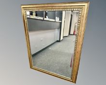 A contemporary gilded mirror,