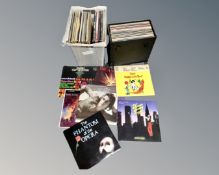 A case and a plastic crate containing a quantity of vinyl LP records including classical.