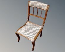 A bedroom chair in striped upholstery
