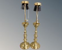A pair of continental brass rise and fall table lamps.