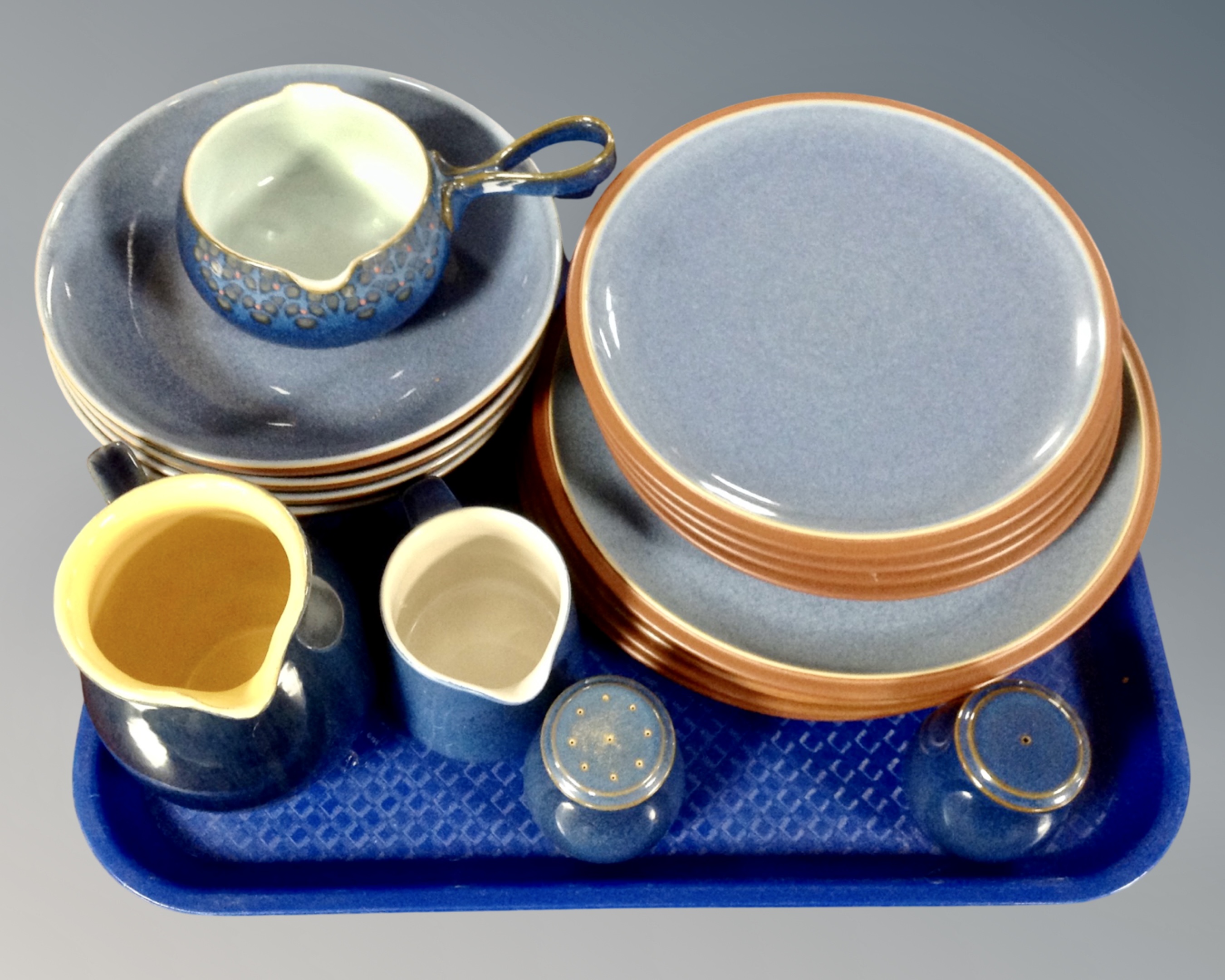 A tray containing 12 Denby blue glazed dinner plates and bowls together with a non matching Denby