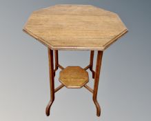 An Edwardian octagonal oak occasional table.