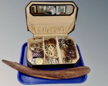 A jewellery box containing a quantity of costume jewellery, compacts, wristwatches etc.