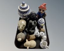 A tray containing pottery animal figures, Inuit carvings, earthenware vase,