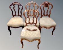 A set of four antique mahogany dining chairs on cabriole legs.
