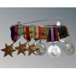 A Second World War medal bar comprising 1939-45 Star, Africa Star, Italy Star, Defence Medal,