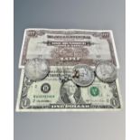 Three replica American silver dollars, a $1 bill, Japanese $100 bill,