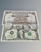 Three replica American silver dollars, a $1 bill, Japanese $100 bill,