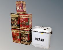 A vintage enamelled bread bin together with five Oriental style tea tins.