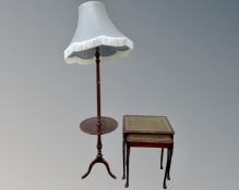 A nest of two glass and leather topped tables together with a stained beech standard