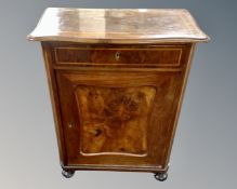 A 19th century mahogany and walnut shaped front cabinet fitted with a drawer.