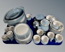 Two trays of approximately 63 pieces of Denby blue glazed coffee and dinnerware.
