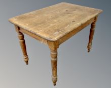 A Victorian pine farmhouse kitchen table.