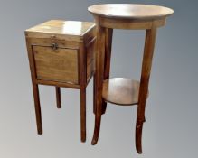 A circular mahogany two tier plant table together with a sewing box on raised legs.