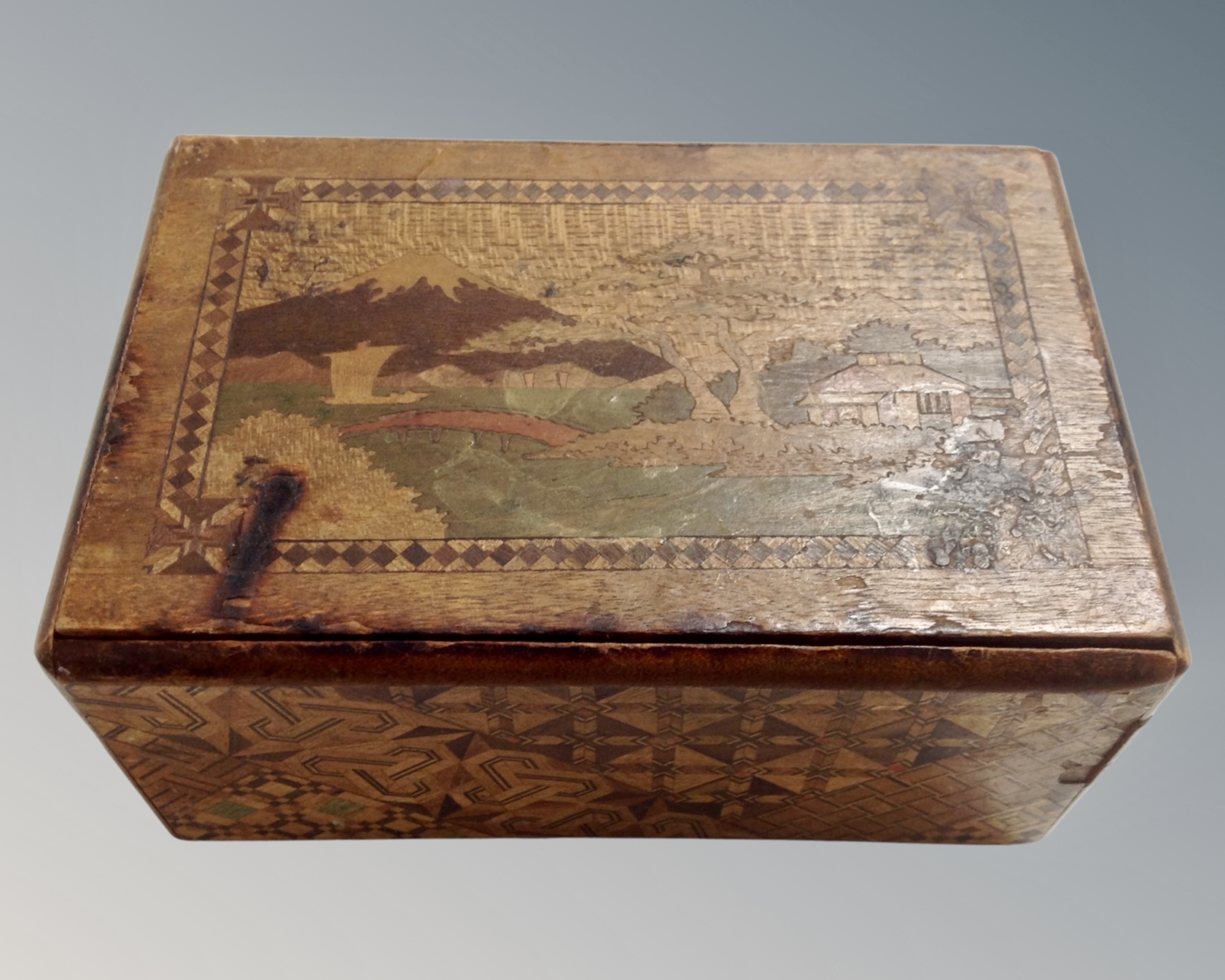 A Japanese parquetry puzzle box depicting Mount Fuji.