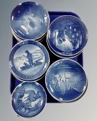 A tray of approximately 23 blue and white porcelain plates by Bing & Grøndahl and Royal Copenhagen.