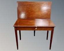 A Victorian inlaid mahogany turnover top tea table.
