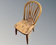 A set of six oak Windsor kitchen dining chairs.