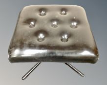 A mid-20th century Scandinavian black vinyl upholstered footstool on metal base.