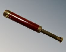 A brass three-draw telescope.