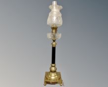 An impressive 19th century oil lamp on ball feet with etched glass reservoir,