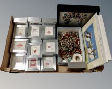 A box containing a small quantity of costume jewellery, framed and unframed prints.