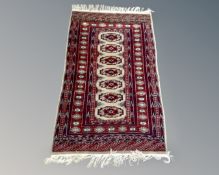 A Bokhara rug, Afghanistan, 172cm by 98cm.