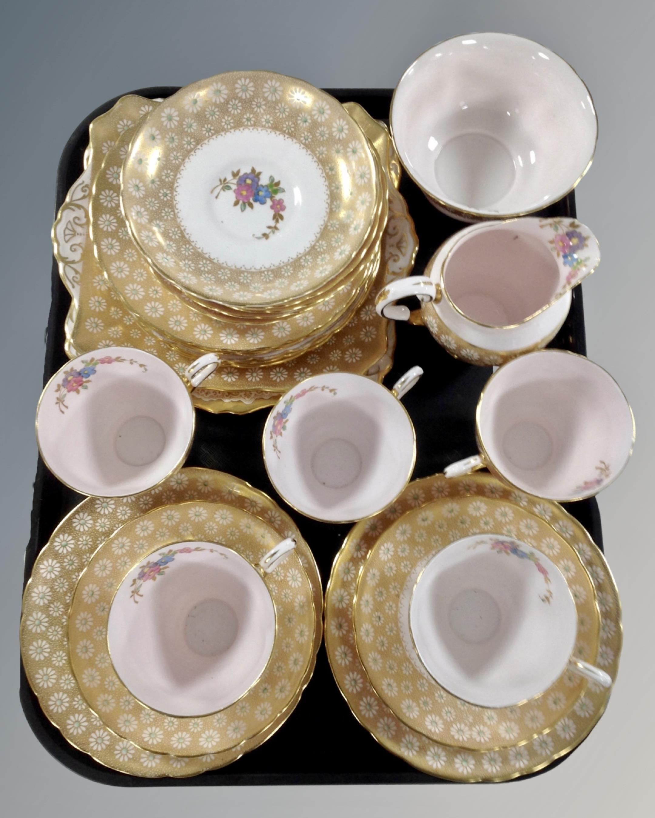 Approximately 24 pieces of Tuscan pink and gilt tea china.