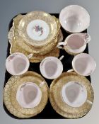 Approximately 24 pieces of Tuscan pink and gilt tea china.